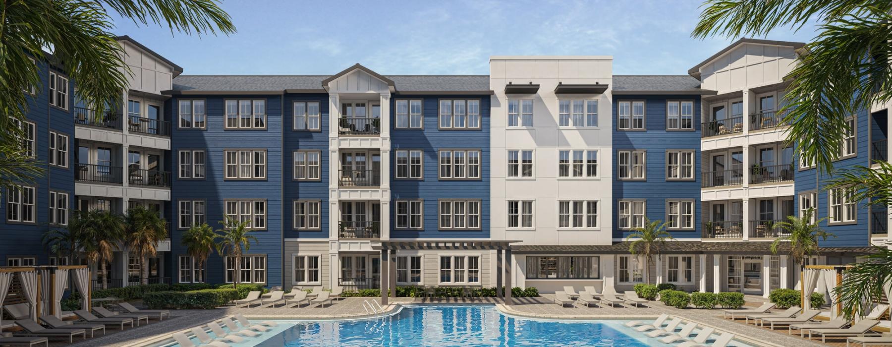 a pool in front of a row of houses