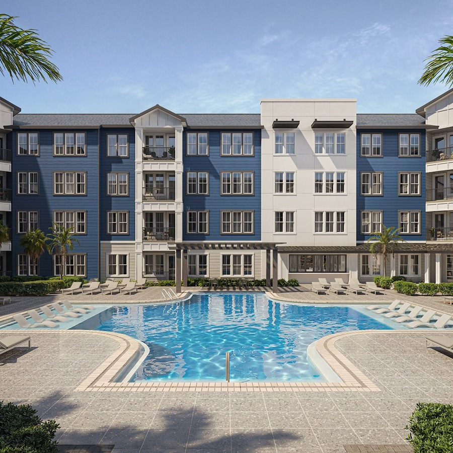 a swimming pool in front of an apartment building